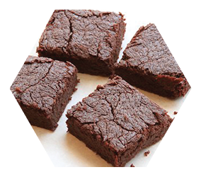 four brownies, up close on white background
