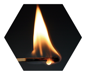 flame on the head of a match slowly burning down the stick close up on black background