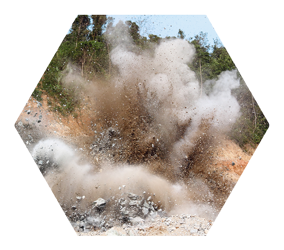 mining blast explosion cloud of dirt, smoke, and rock debris