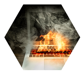 laptop keyboard covered in smoke and flames